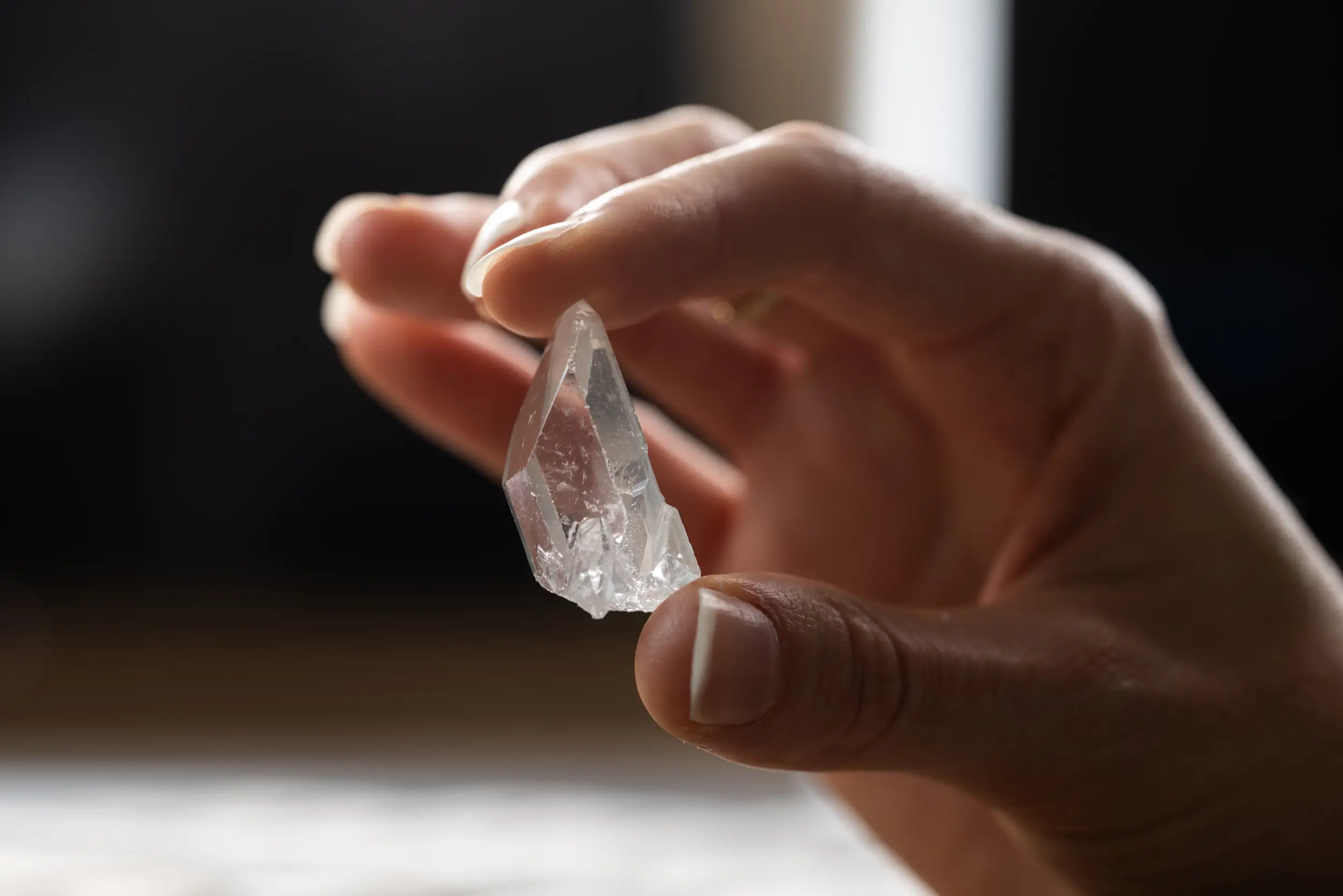 A Crystal Class crystal held in a hand.